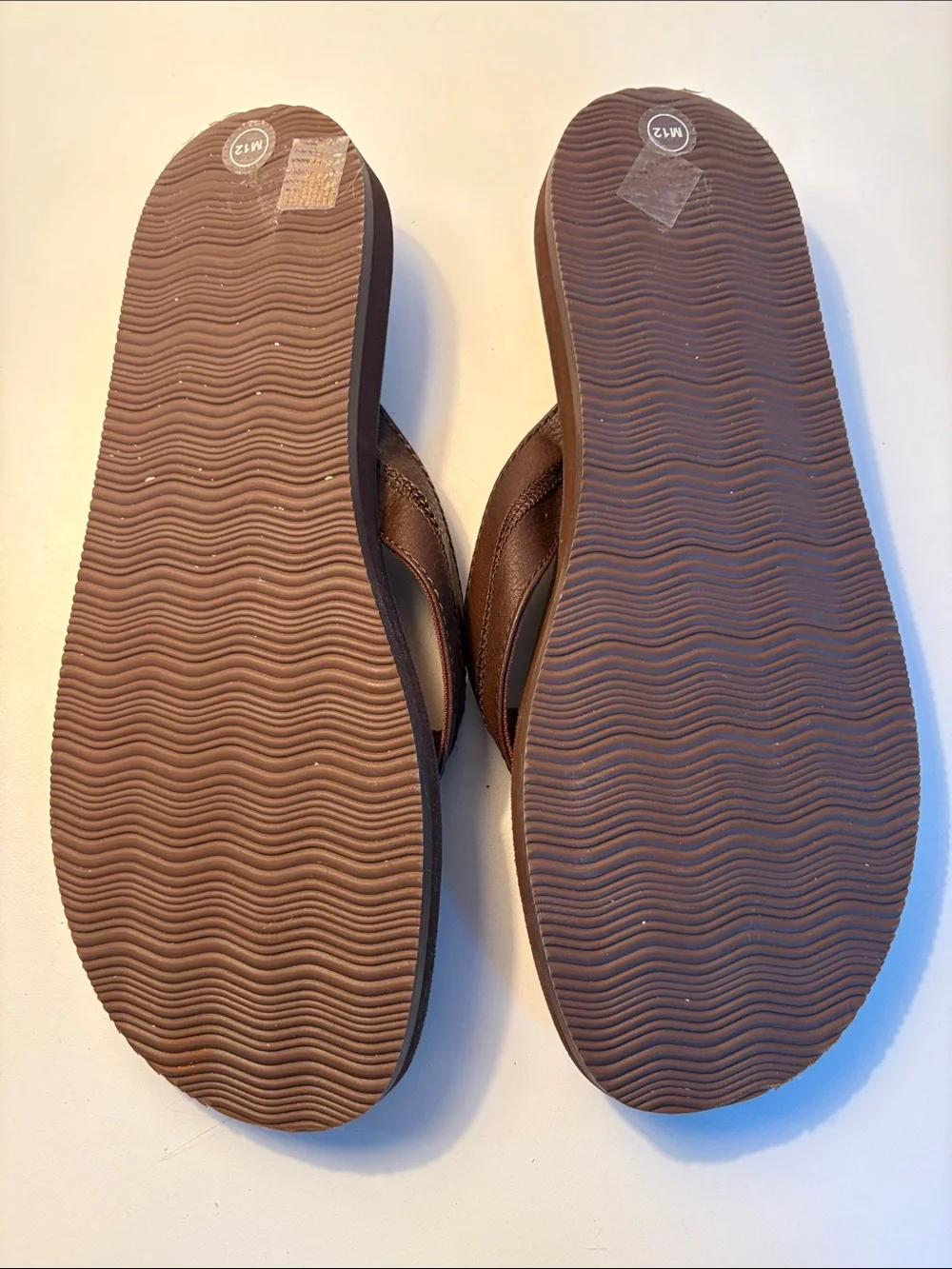 THREE pairs of men’s flip flops
